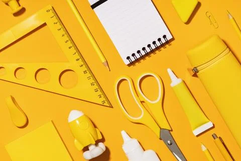 Assorted office and school white yellow stationery Stock Photos