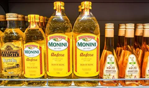 Assorted olive oils in bottles ready for sale in the superstore Stock Photos