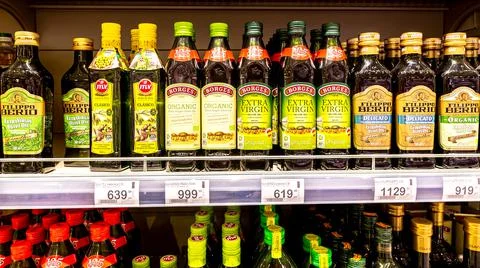 Assorted olive oils in bottles ready for sale Stock Photos