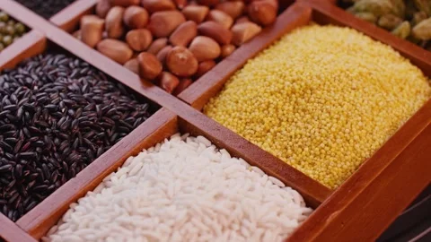 Assorted Organic Grains and Legumes Displayed in Wooden Divided Tray 動画素材 336560417