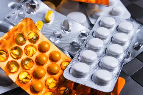 Assorted packets or blisters of various pills. Stock Photos
