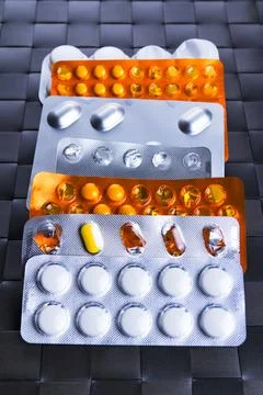 Assorted packets or blisters of various pills. Stock Photos