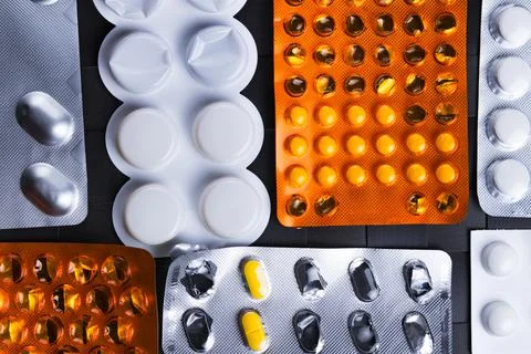 Assorted packets or blisters of various pills. Stock Photos