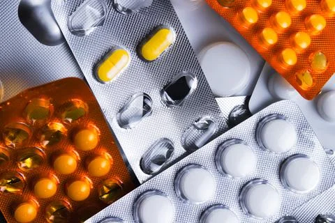 Assorted packets or blisters of various pills. Stock Photos