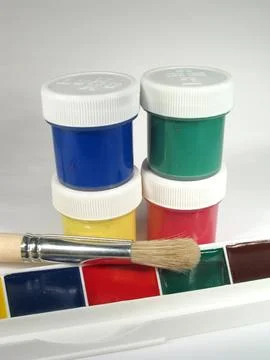 Assorted Paint Jars with Brushes Stock Photos