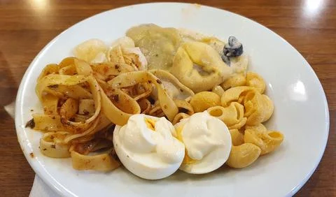Assorted pasta dish and eggs with mayonnaise. Stock Photos