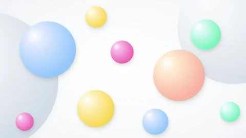 Assorted pastel spheres of varying sizes floating on a clean white backgrou.. 動画素材 336364930