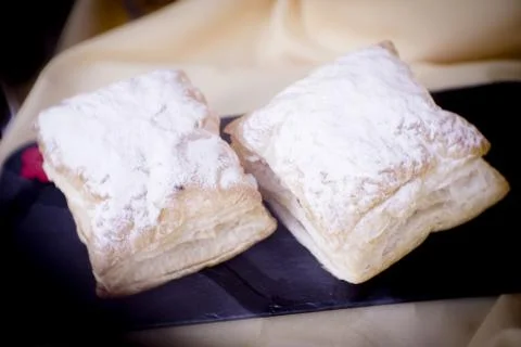 Assorted pastries and sweets placed in a bakery display Stock Photos