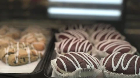 Assorted pastries with decorative icing close-up of colorful pastries with Stock Footage 294946014