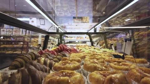 Assorted pastry and bread arranged on tray selling at bakery shop. Stock Footage 284816592