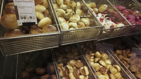 Assorted pastry and bread arranged on tray selling at bakery shop. 動画素材 285515554