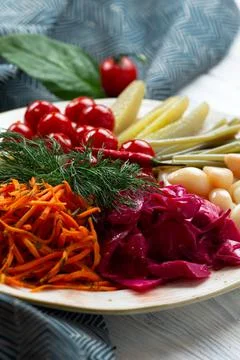 Assorted pickled and salted vegetables in a plate. Stock Photos