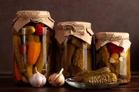 Assorted Pickled Vegetables in Rustic Jars Stock Photos