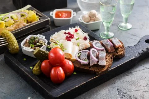 Assorted pickled vegetables - Sauerkraut cabbage, cucumbers, tomatoes, mush.. Stock Photos