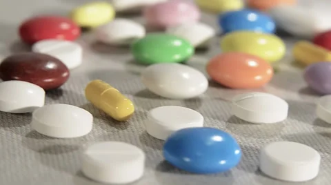 Assorted pills and capsules, close up Video stock 32455510