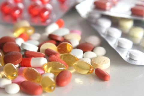 Assorted pills on the table Stock Photos