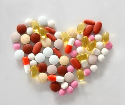 Assorted pills on the table Stock Photos