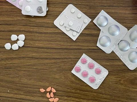 Assorted Pills on a Table Stock Photos