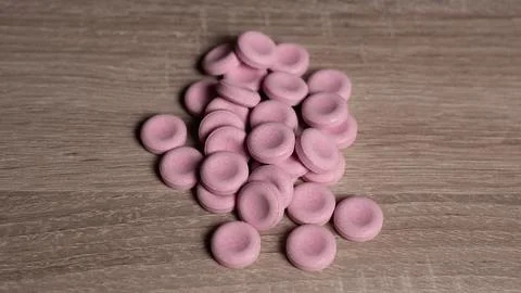 Assorted Pink Foam Tips On Rustic Wooden Surface For Retail Presentation, Bright Stock Photos