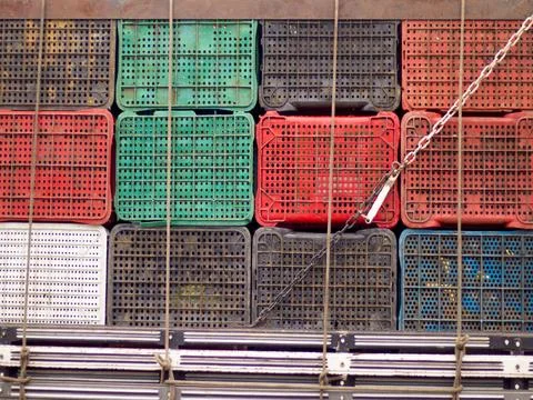Assorted plastic crates on a truck Stock Photos