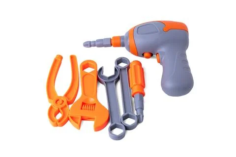 Assorted plastic toy tools set including drill wrench and pliers isolated o.. Stock Photos