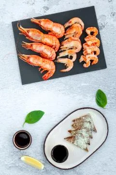 Assorted plate of fresh raw king prawn and boiled jumbo shrimps Stock Photos