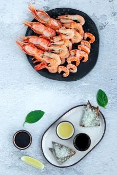 Assorted plate of fresh raw king prawn and boiled jumbo shrimps Stock Photos