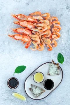 Assorted plate of fresh raw king prawn and boiled jumbo shrimps Stock Photos