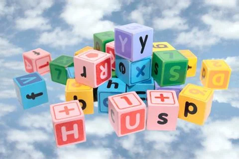 Assorted play blocks on clouds Stock Photos