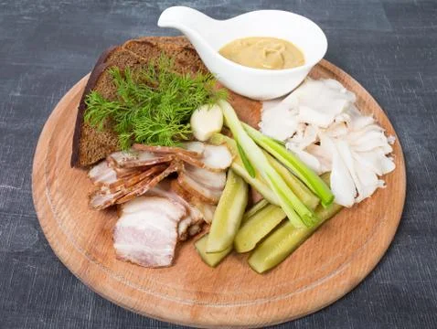 Assorted pork fat with pickles. Stock Photos