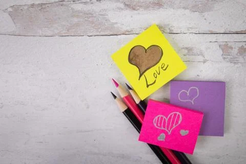 Assorted posted note with love and hearts on rustic wood background Stock Photos