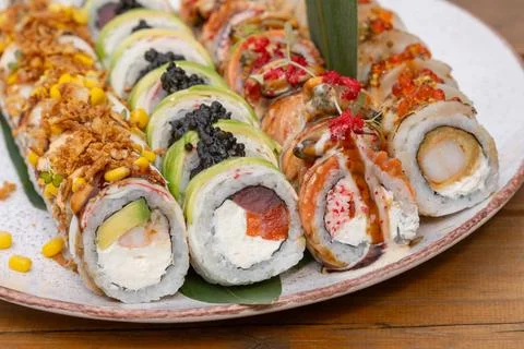 Assorted premium sushi roll platter featuring avocado, tuna, salmon, black ca 写真素材