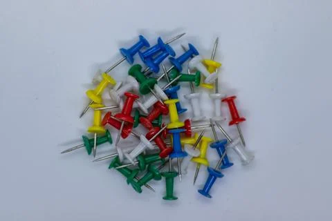 Assorted Push Pins with Sharp Metal Points on Minimal Background Stock Photos