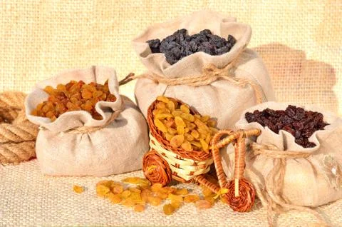 Assorted raisins in the bags on the sacking Stock Photos