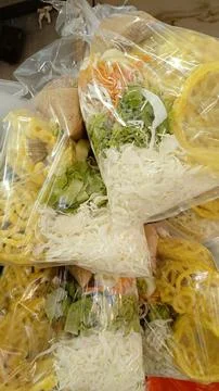 Assorted raw vegetables served with peanut sauce, boiled tofu, crackers Stock Photos