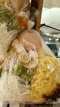 Assorted raw vegetables served with peanut sauce, boiled tofu, crackers Stock Photos