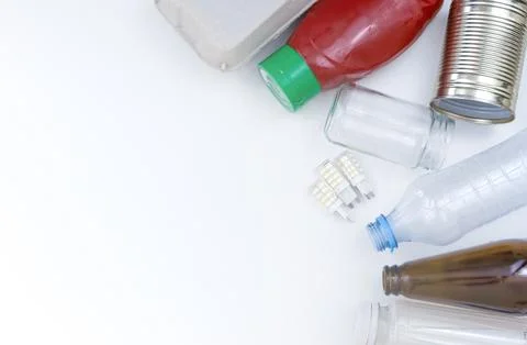 Assorted Recyclable Materials Arranged on White Background Stock Photos