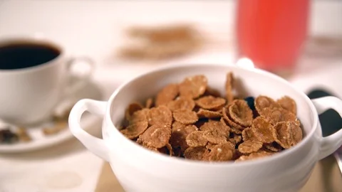 Assorted red and black fruit falling into bowl Stock Footage 93916048
