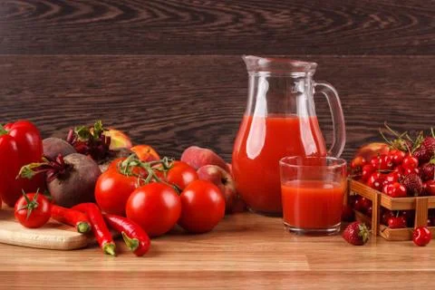 Assorted red raw organic vegetables and fruit Stock Photos