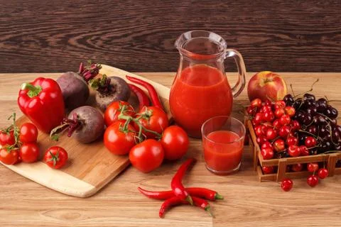 Assorted red raw organic vegetables and fruit Stock Photos