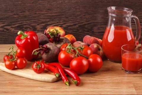 Assorted red raw organic vegetables and fruit Stock Photos