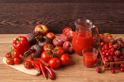 Assorted red raw organic vegetables and fruit Stock Photos