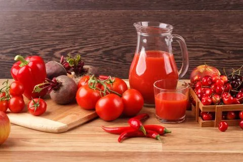 Assorted red raw organic vegetables and fruit Stock Photos