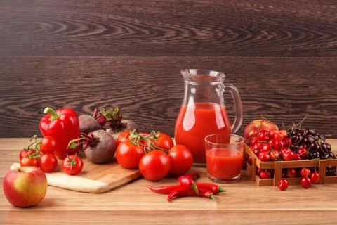 Assorted red raw organic vegetables and fruit Foto stock
