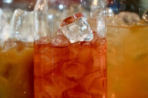 Assorted refreshing iced cocktails and beverages in elegant stemless glasses on Stock Photos