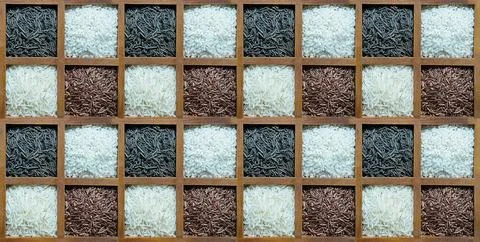 Assorted rice black and red pattern stacked in wooden section box Stock Photos