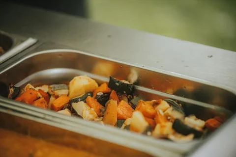 Assorted roasted vegetables including squash, carrots, and potatoes display.. 写真素材