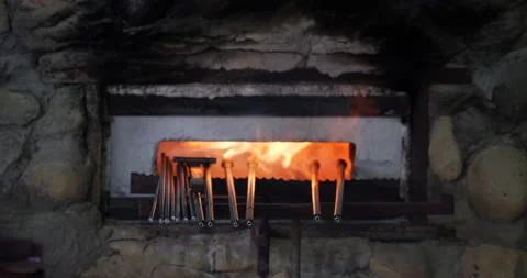 Assorted rods for heating glass or metal in a door of a furnace Stock Footage 171199221