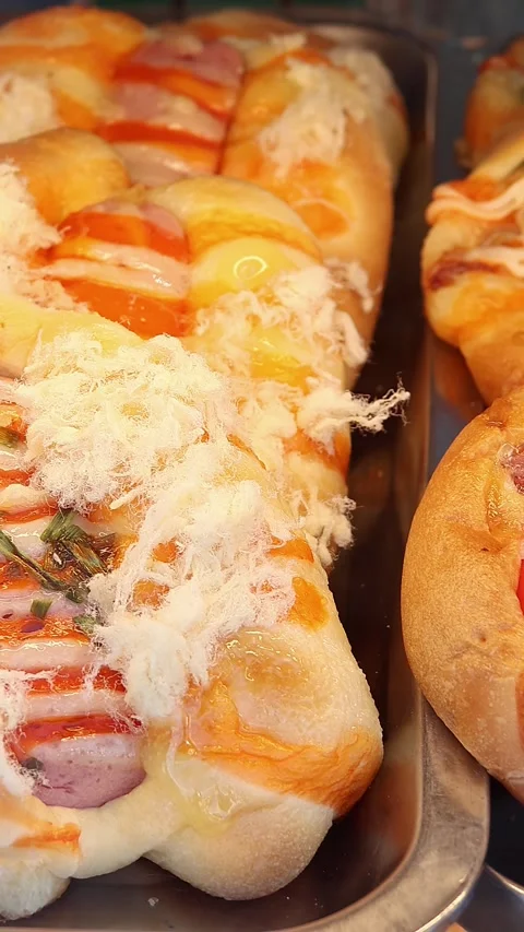Assorted Savory Bakery Snacks and Mini Pizzas Stock Footage 337736035