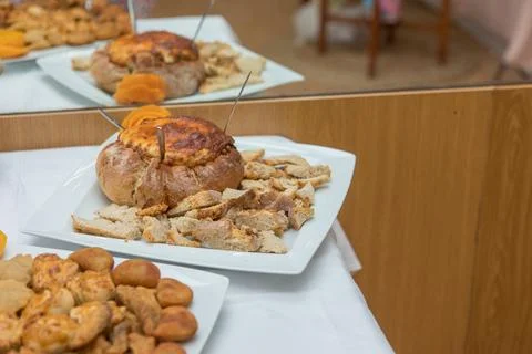 Assorted savory snacks buffet on white tablecloth Stock Photos